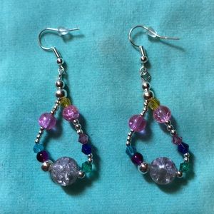 These are a handcrafted pair of earrings .